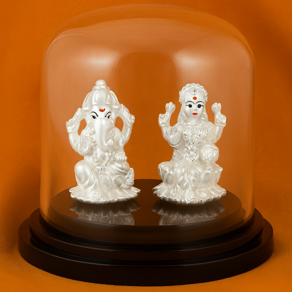 Two silver statues under a clear glass dome on an orange background