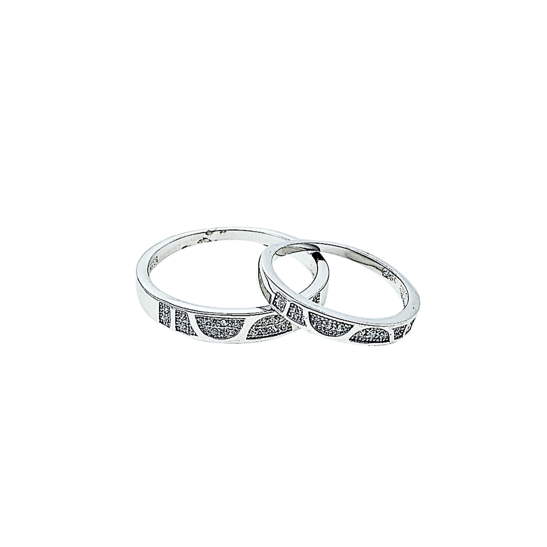 Two silver hoop earrings with small diamonds on a white background