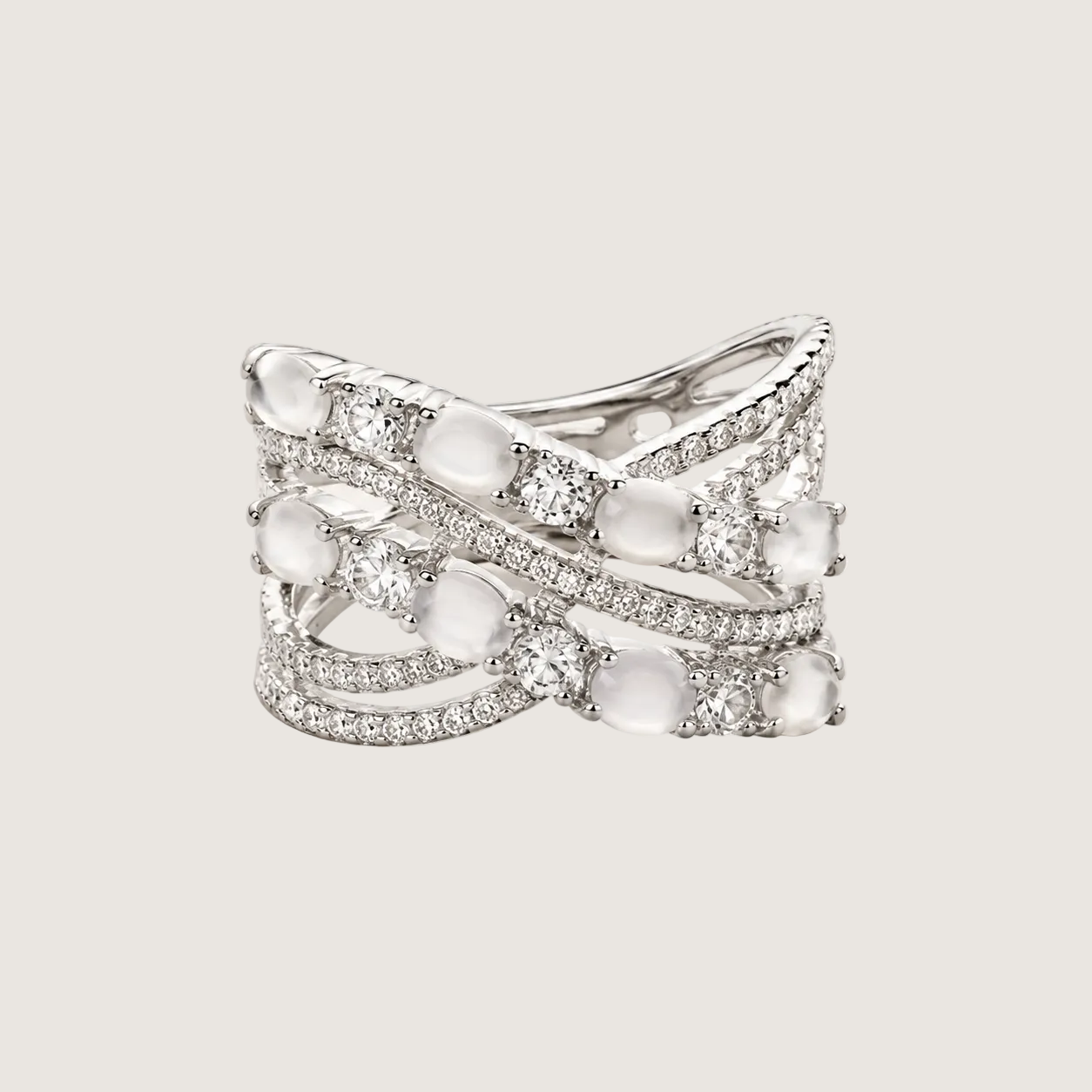 Silver ring with gemstones on a light gray background