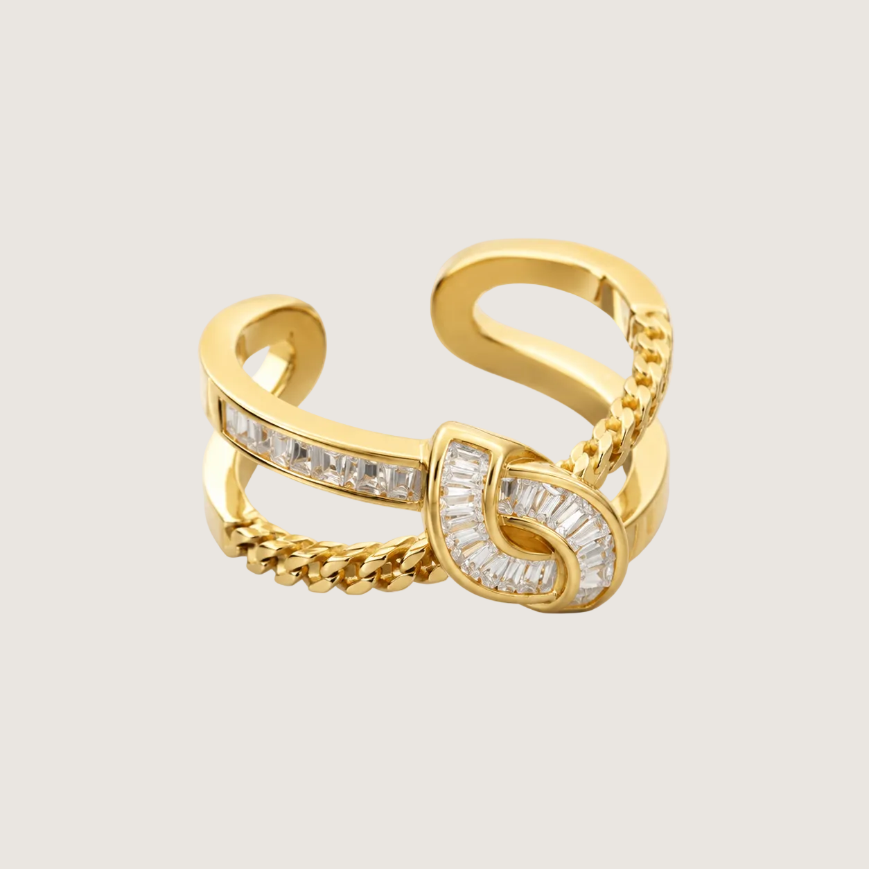 Gold ring with diamond accents on a beige background