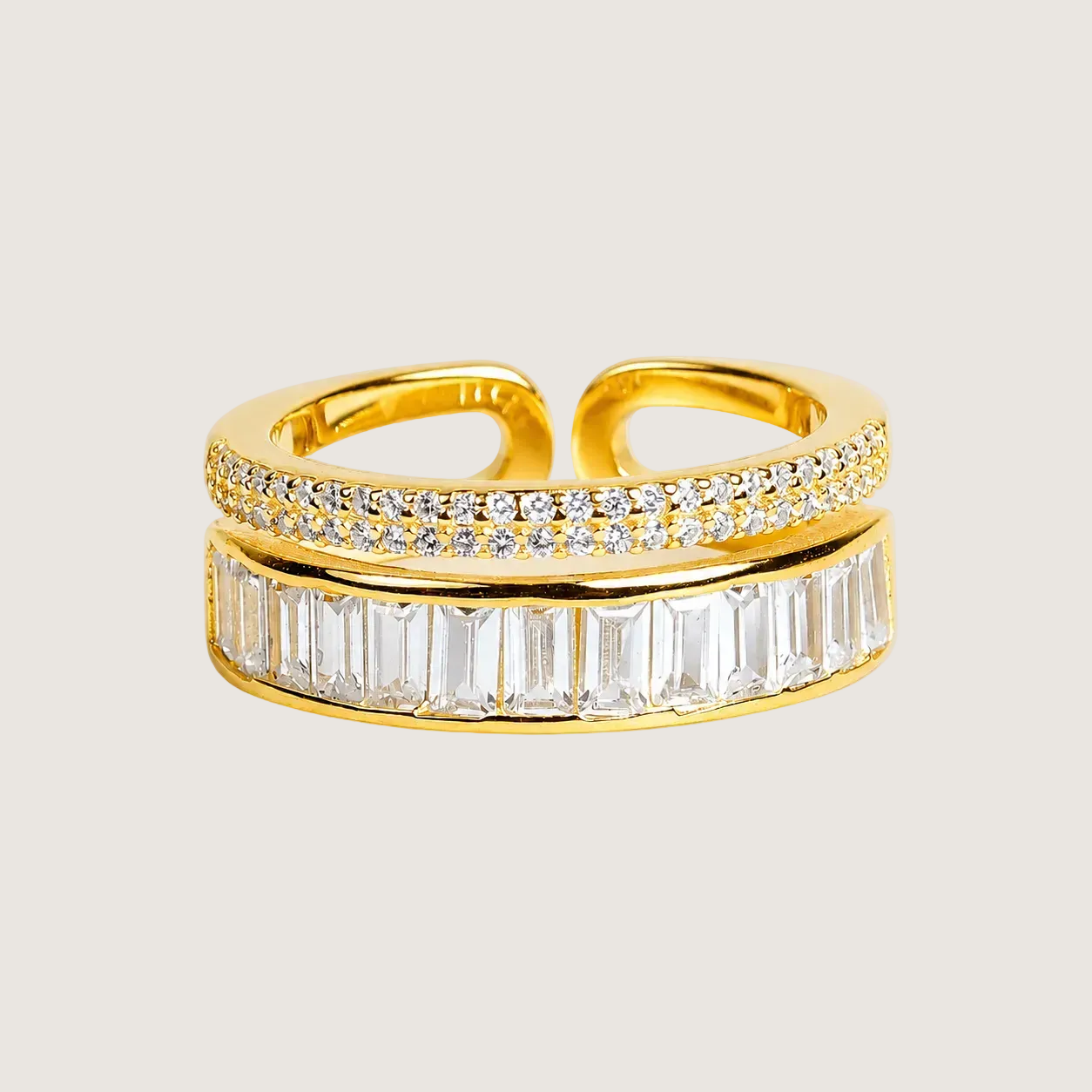 Gold ring with diamond accents on a beige background