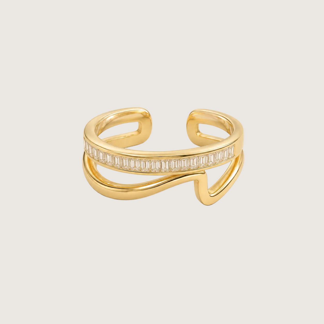 Gold ring with diamond accents on a light beige background