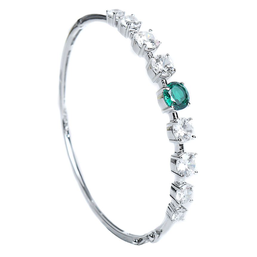 silver bracelet with sparkling green stone