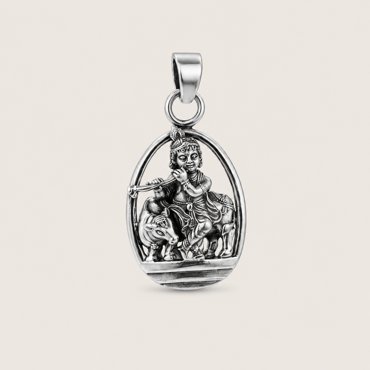 Silver pendant with a religious figure on a beige background