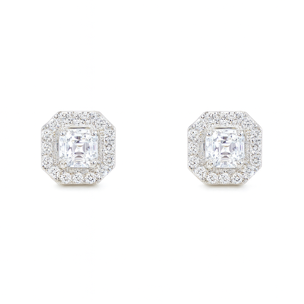 Pair of diamond stud earrings on a white background