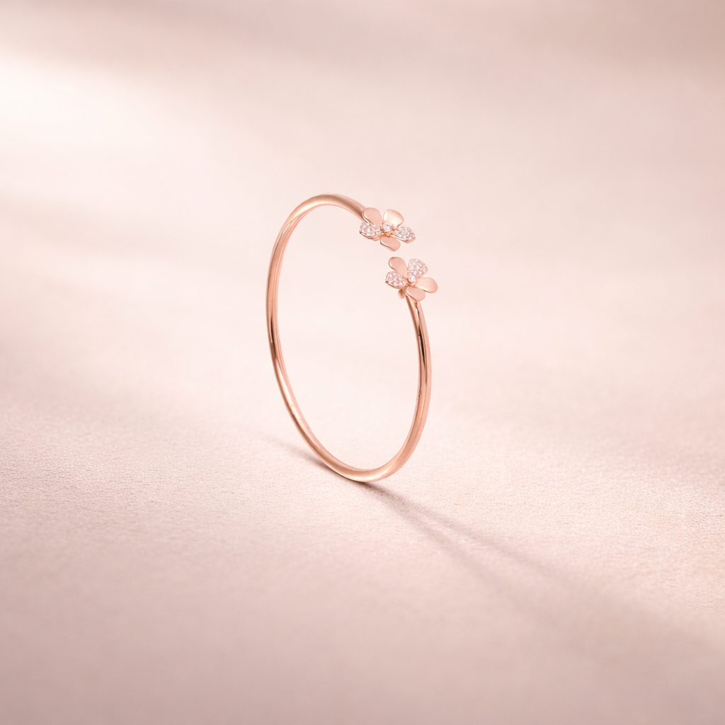 Rose gold bracelet on a soft pink background