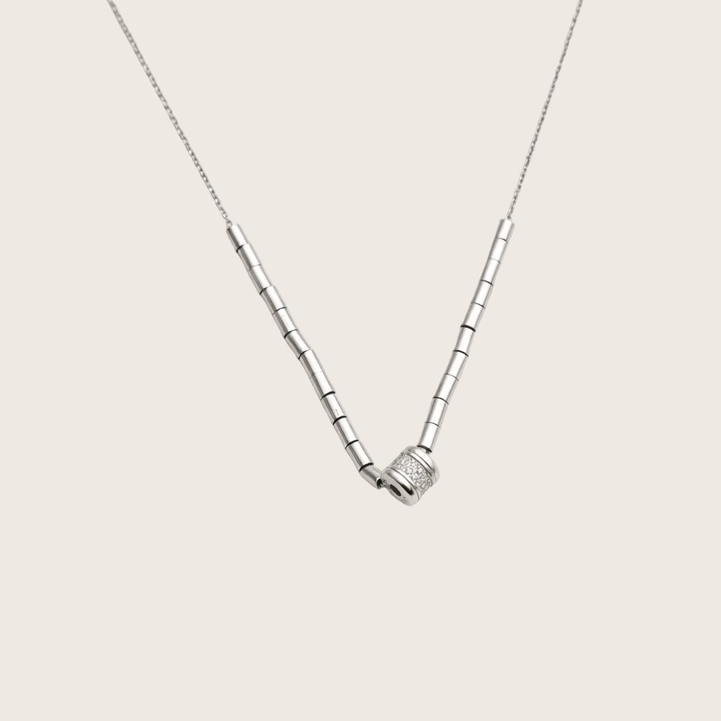 Silver necklace with a unique clasp on a white background