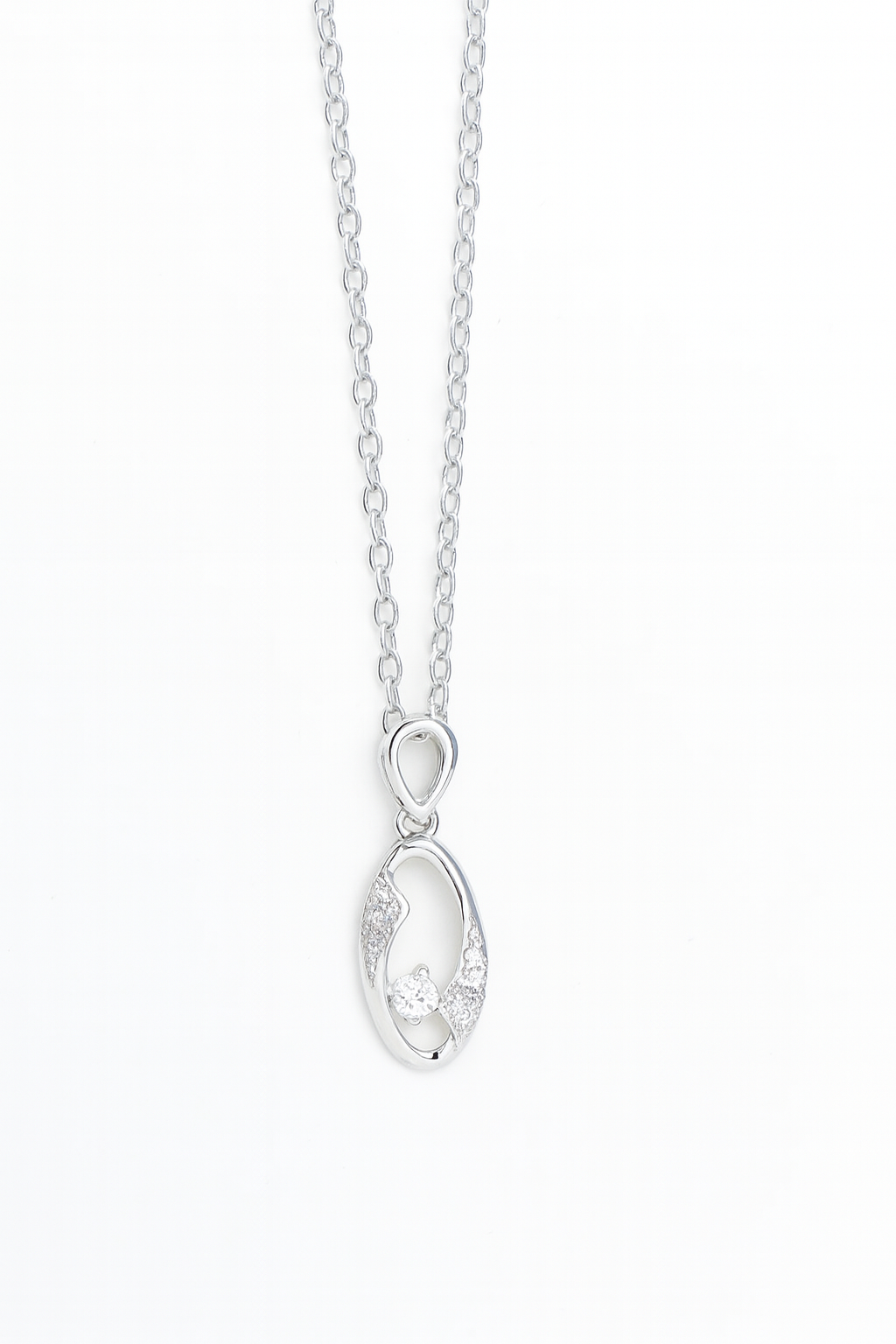 Silver necklace with a teardrop-shaped pendant on a white background