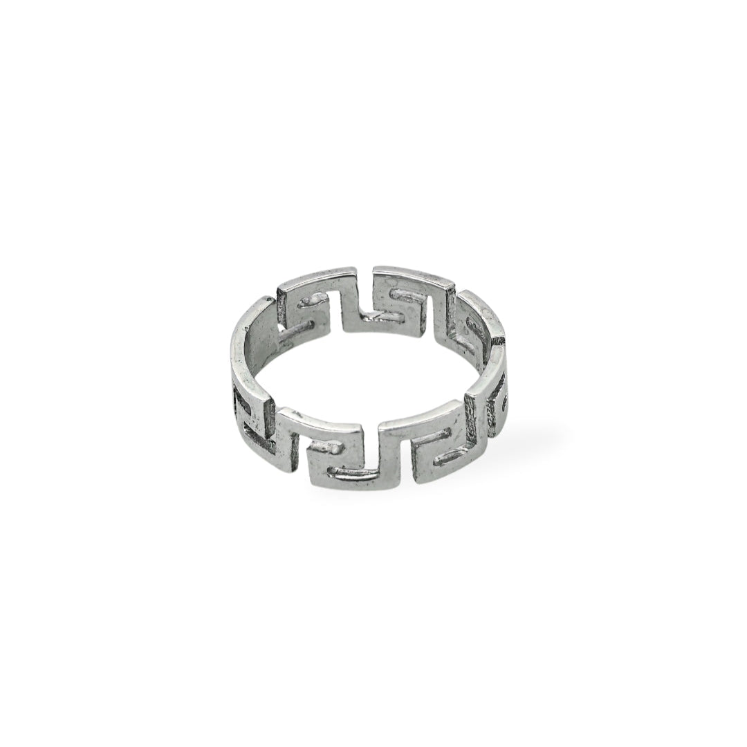 Silver ring with geometric design on a white background, branded 'Trishnna'.