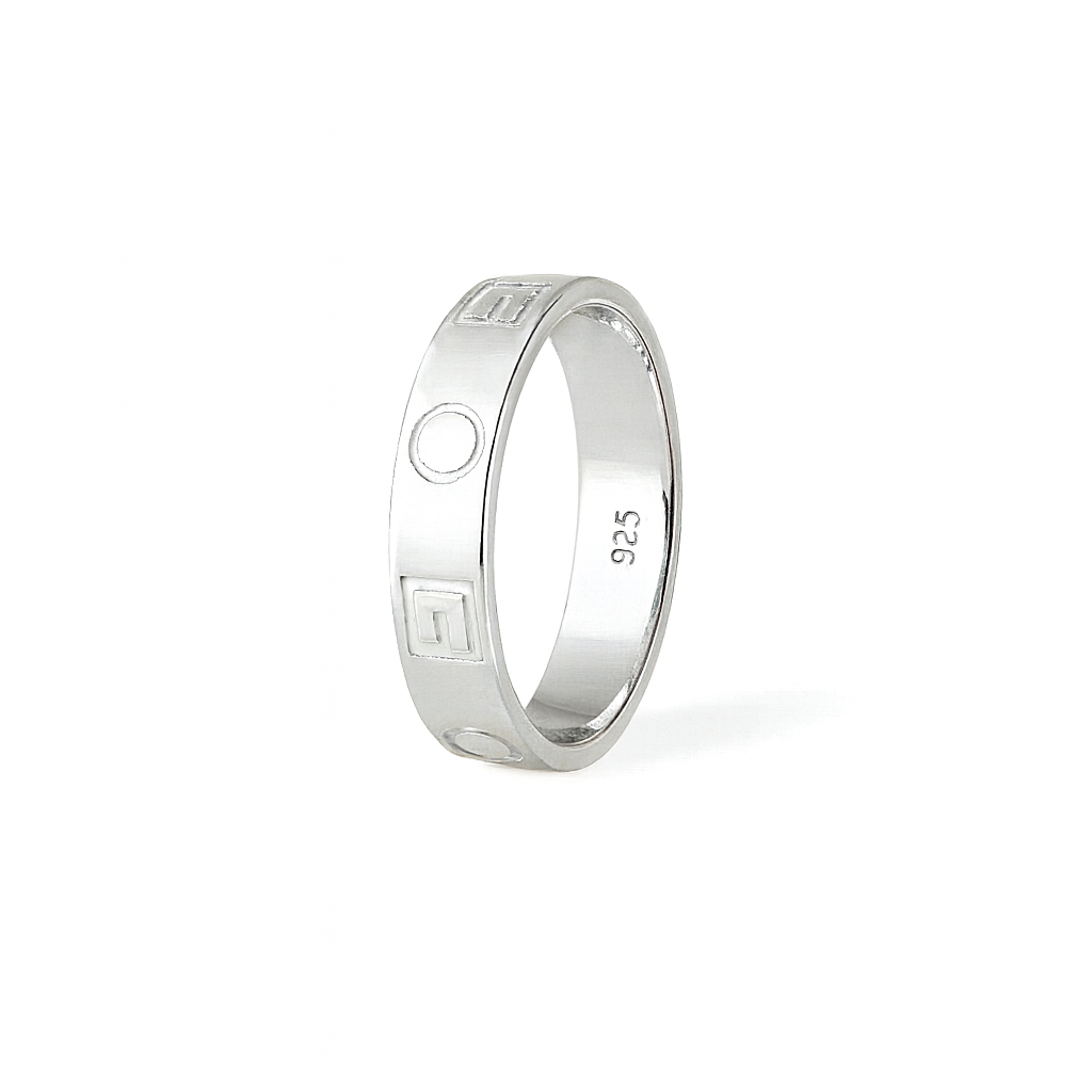 Silver ring with engraved design on a white background