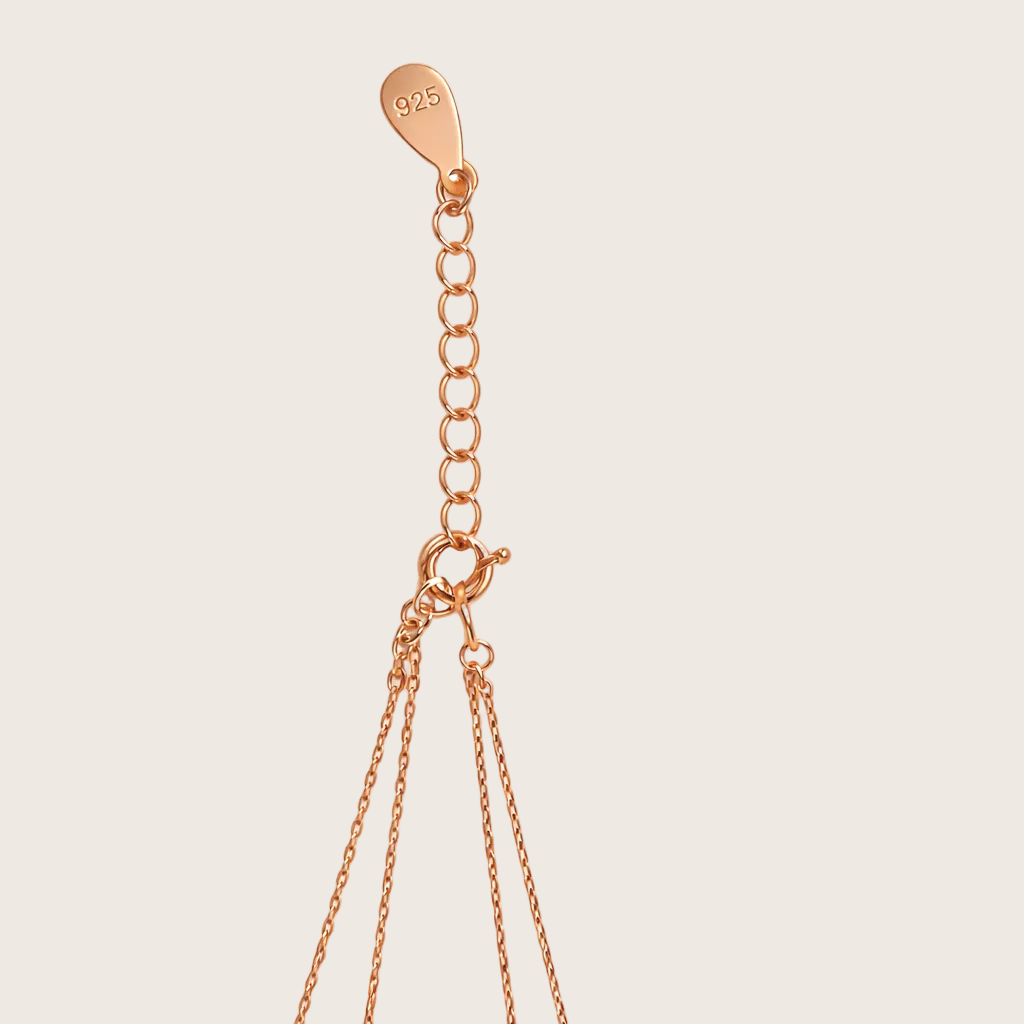 Rose gold necklace chain with clasp on a white background