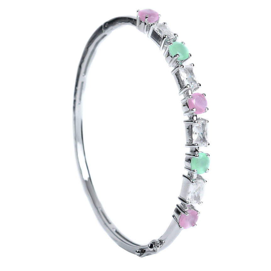 silver bracelet with sparkling green and pinkish stone