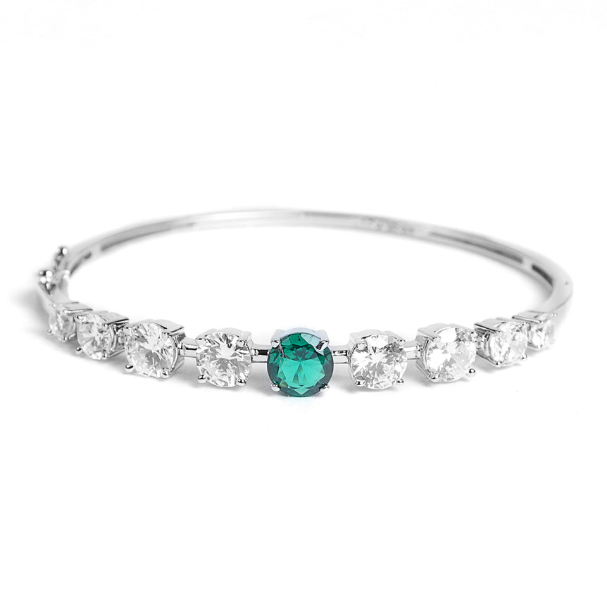 silver bracelet with sparkling green stone